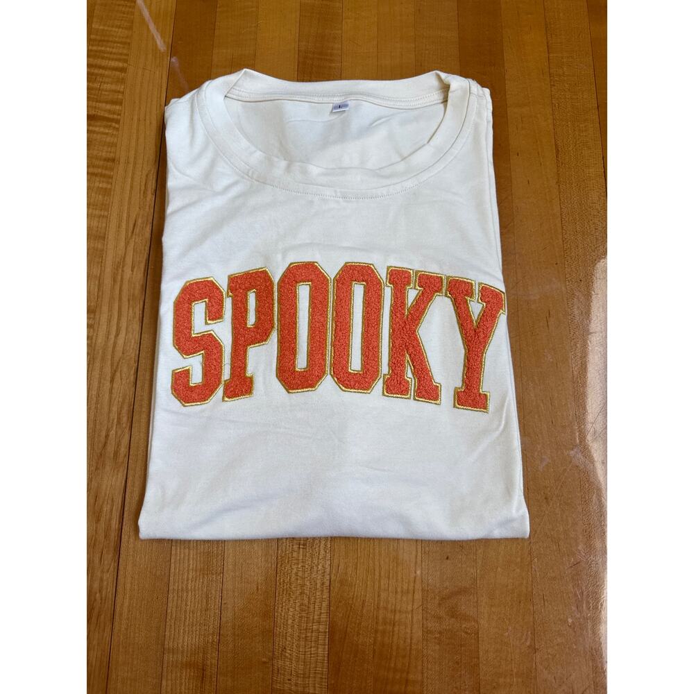 Spooky Women’s, large cream and orange short sleeved T-shirt new without tags